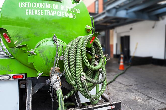 a grease trap pumping truck at a restaurant in Barrington, IL